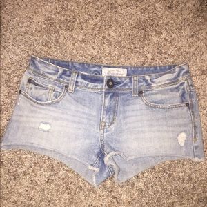 Light washed jean shorts.